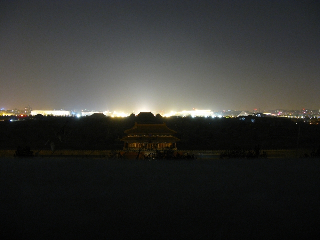 This is basically the same photo but taken with a much longer shutter.  This is so you can see the egg-shaped building in the right of the background of the picture.  This building is the Grand National Theater.  I fully intend to take in a concert or two at that building!  Forbidden City = still dark. Even with a long shutter.