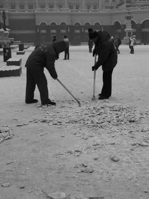 These people are removing the snow from the square near St. Sophia Church.  Notice the tools they have.  Behind me are their brooms.  I think they might be there a while.