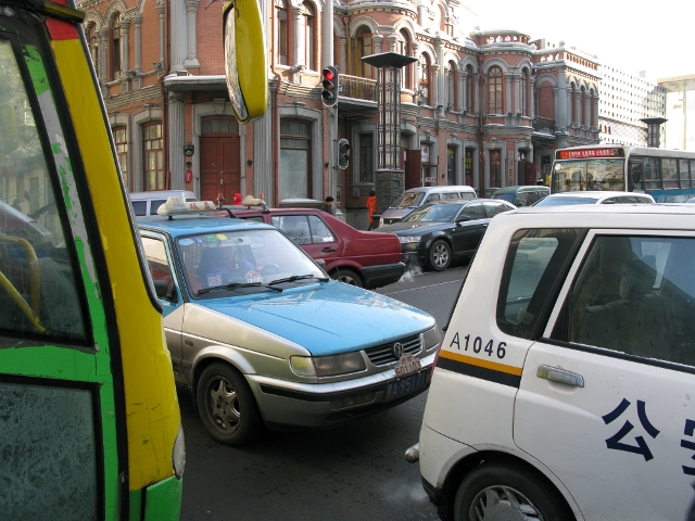 This reminded me of that game where you have to rearrange the vehicles to try to get one out!  Traffic was worse in Haerbin than in Beijing. 