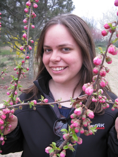 The other teacher I was with insisted on taking a picture of me with the blossoms! Notice my nail polish.  The color is called "cherry blossom" :)